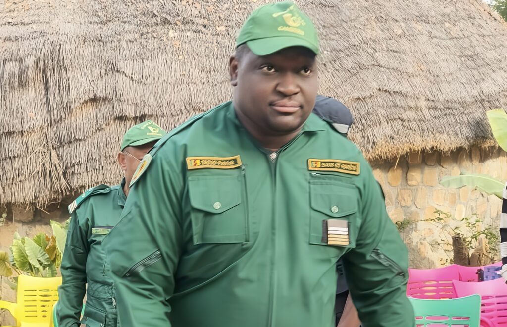 A soldier in a green uniform.
